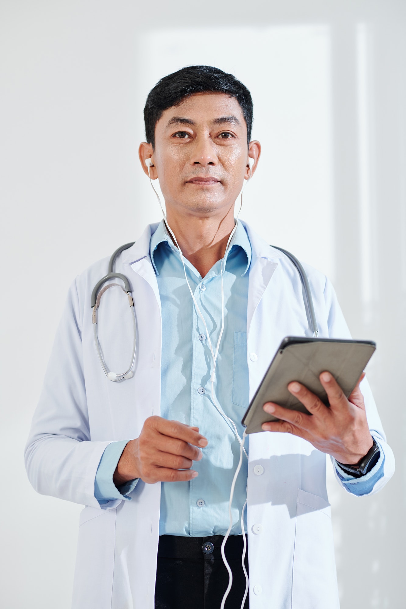 Doctor with tablet computer