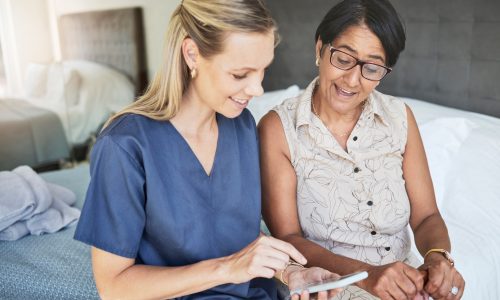 Happy woman, nurse and phone in elderly care for consultation, support or healthcare diagnosis at h